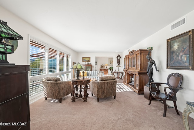 living room with light colored carpet and visible vents