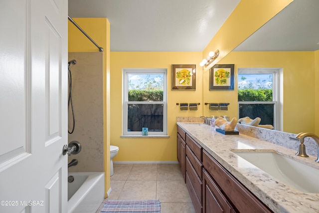 bathroom featuring double vanity, a wealth of natural light, and a sink
