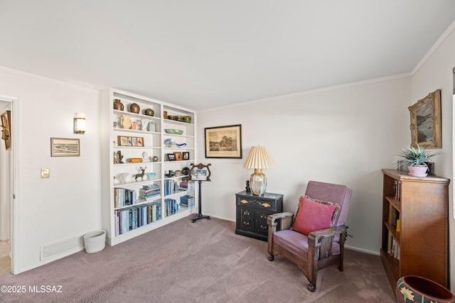 living area featuring baseboards, ornamental molding, carpet, and visible vents