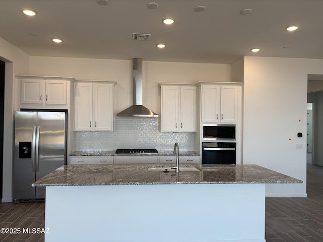14722 E Sands Ranch Rd, Vail, AZ 85641 - kitchen featuring appliances with stainless steel finishes, a sink, wall chimney range hood, wood finish floors, and white cabinetry