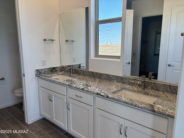 14722 E Sands Ranch Rd, Vail, AZ 85641 - bathroom with toilet, double vanity, and baseboards