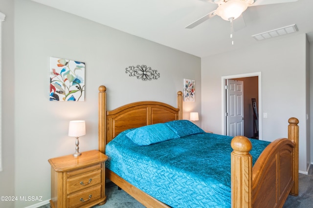 carpeted bedroom with visible vents and ceiling fan