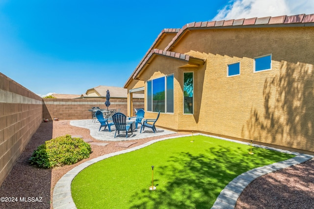 view of yard with a patio and a fenced backyard