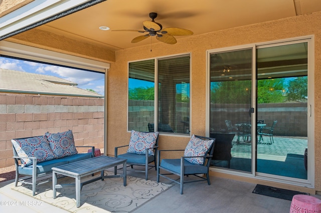 view of patio with outdoor lounge area, a ceiling fan, and fence