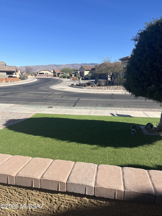 view of yard featuring a residential view