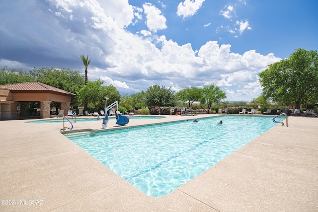 community pool featuring a patio area and a gazebo