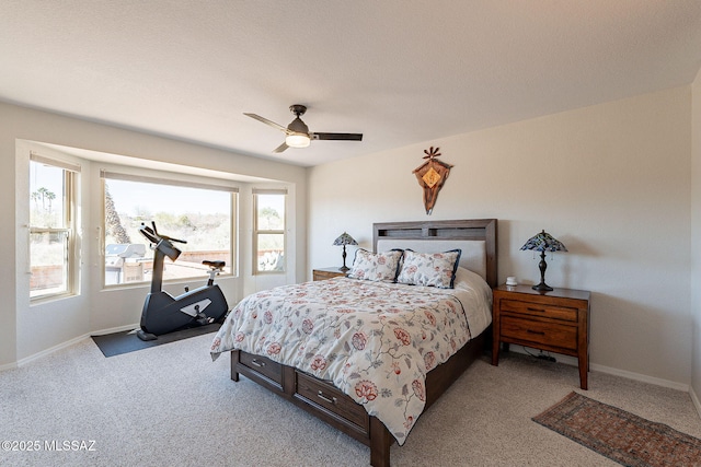 bedroom featuring baseboards, carpet floors, and a ceiling fan