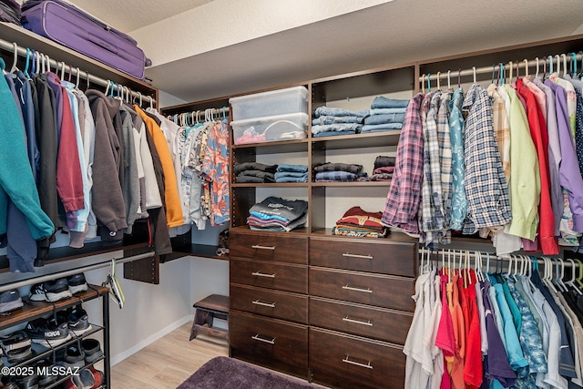 spacious closet with wood finished floors