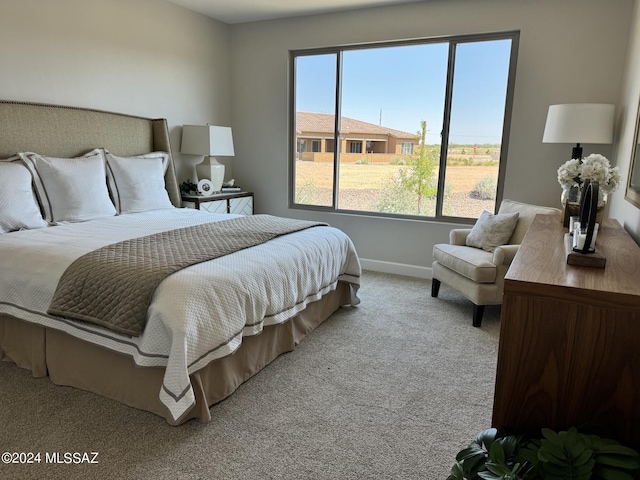 carpeted bedroom with baseboards