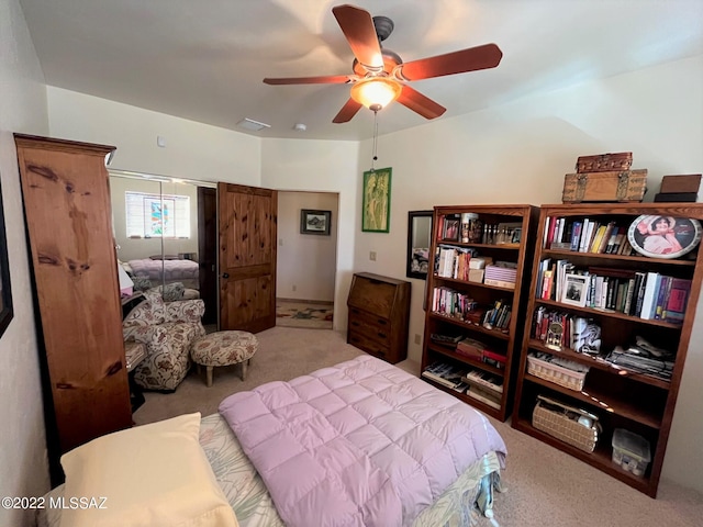 carpeted bedroom with visible vents, a ceiling fan, and a closet