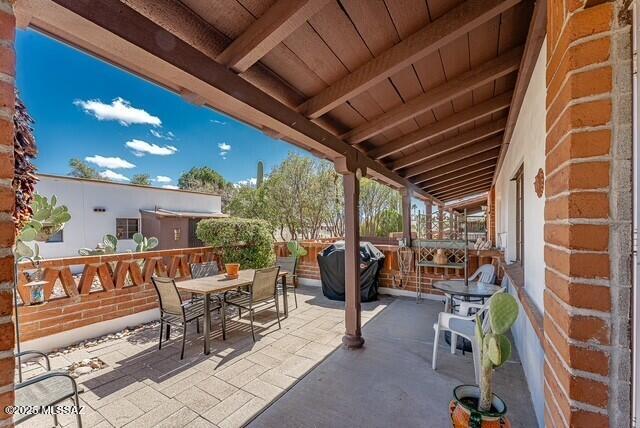 view of patio / terrace featuring a grill and outdoor dining area