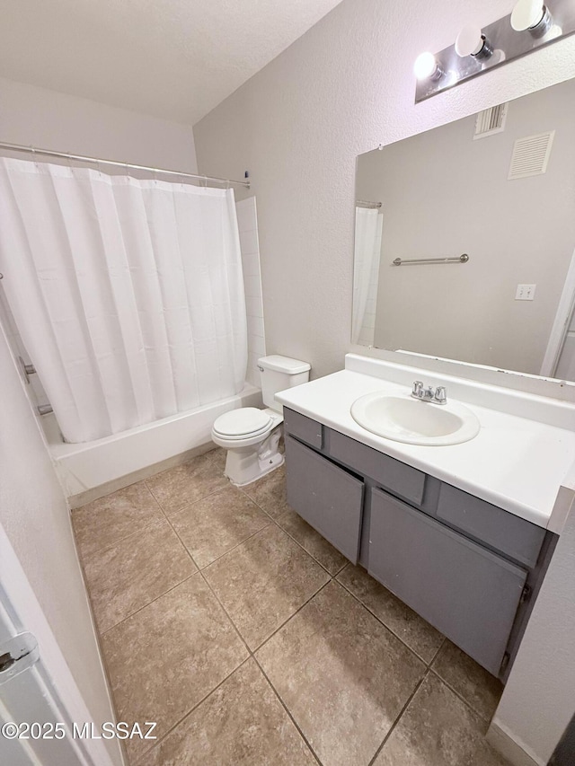 full bath featuring visible vents, toilet, vanity, and tile patterned flooring
