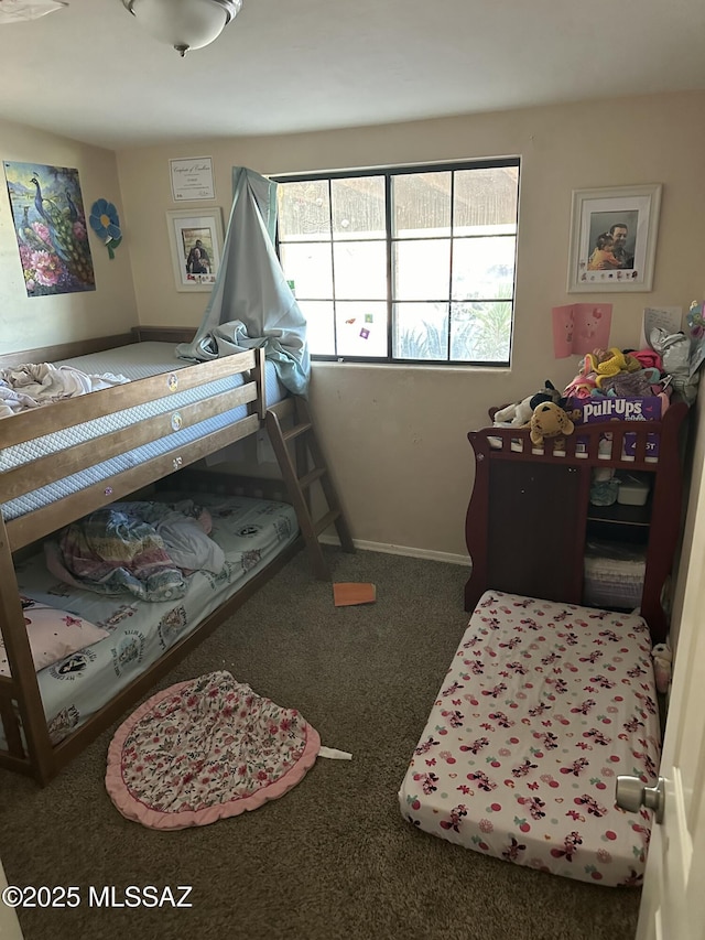 carpeted bedroom with baseboards