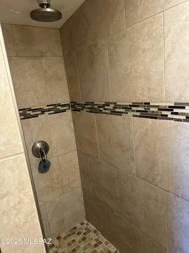 details with a tile shower