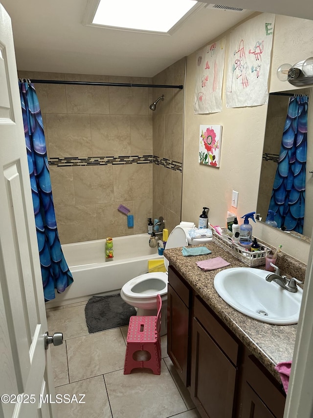 bathroom with shower / bathtub combination with curtain, toilet, vanity, and tile patterned flooring