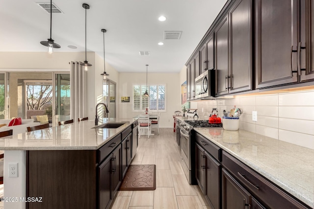kitchen featuring visible vents, a sink, and appliances with stainless steel finishes