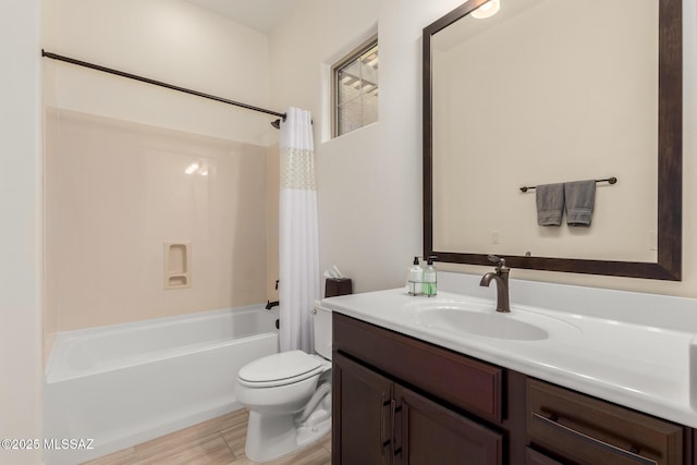 full bathroom featuring toilet, vanity, and shower / bath combo with shower curtain