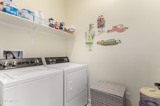 clothes washing area with laundry area and separate washer and dryer