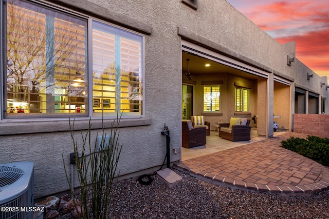 exterior space with central AC unit and an outdoor living space