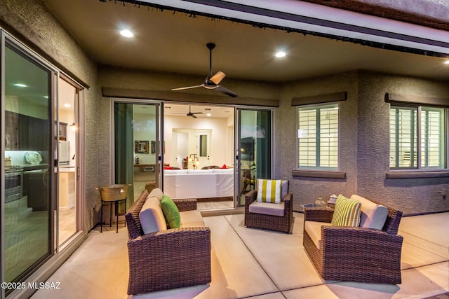 view of patio featuring an outdoor living space and a ceiling fan