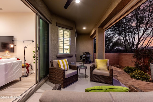 view of patio / terrace with an outdoor hangout area, fence, area for grilling, and a ceiling fan