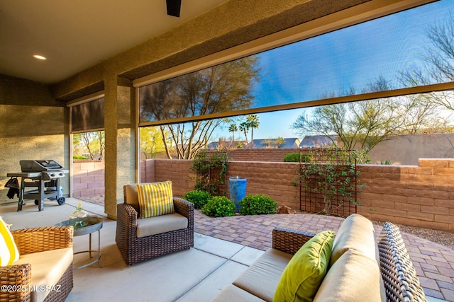 view of patio / terrace featuring an outdoor living space, fence, and area for grilling