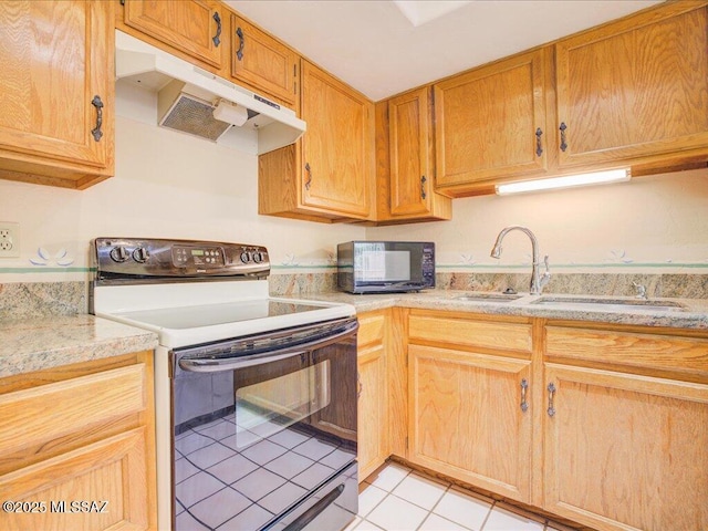 kitchen with under cabinet range hood, light countertops, electric stove, light tile patterned floors, and black microwave