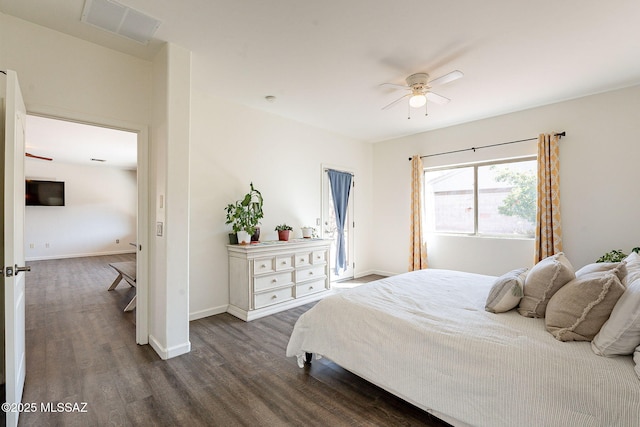 bedroom with visible vents, ceiling fan, dark wood-type flooring, and baseboards