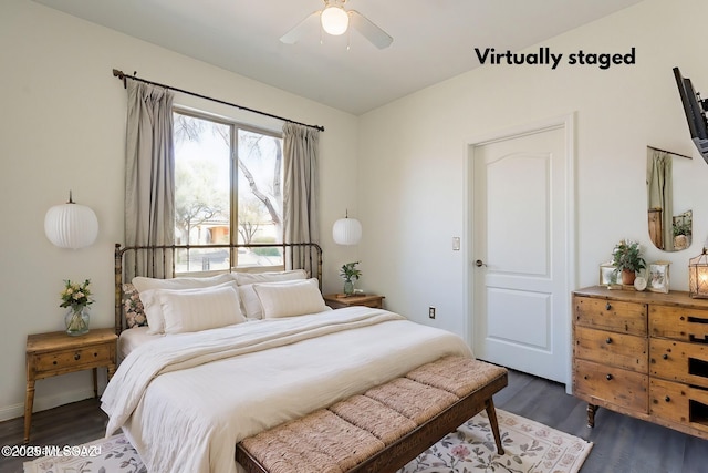 bedroom featuring ceiling fan and dark wood-style flooring