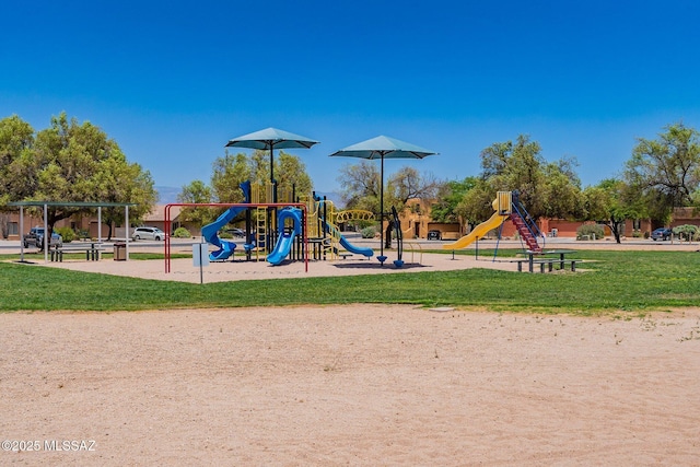 communal playground featuring a yard