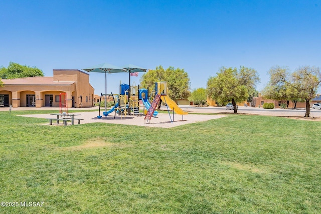 community jungle gym with a yard