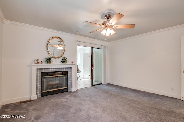 unfurnished living room featuring visible vents, carpet, a fireplace, and crown molding