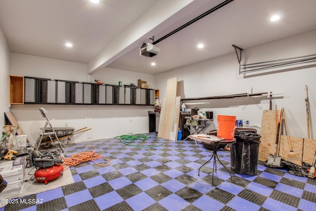 garage with a garage door opener and recessed lighting