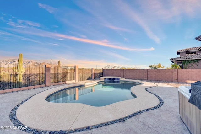 view of swimming pool featuring a patio area, a fenced backyard, and a fenced in pool