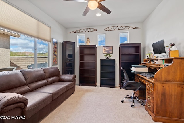 office area featuring a ceiling fan and carpet