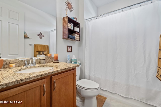 full bath with toilet, shower / bath combo, and vanity