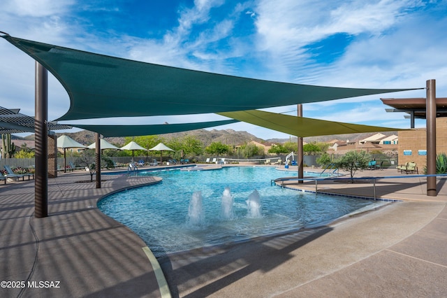 pool featuring a patio and fence