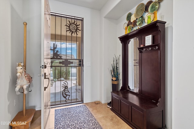 mudroom with light tile patterned floors