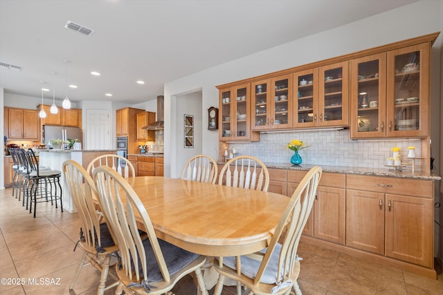 dining room with light tile patterned floors, recessed lighting, and visible vents