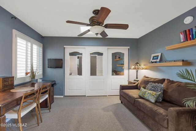 499 W Windowmaker Rd, Tucson, AZ 85737 - living room featuring carpet flooring, baseboards, and a ceiling fan