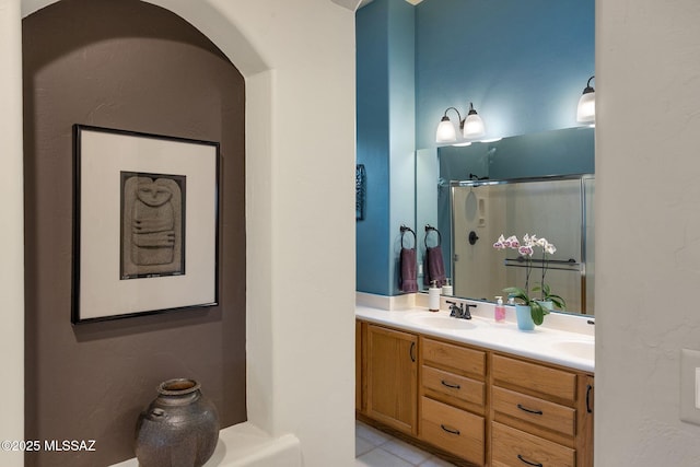 499 W Windowmaker Rd, Tucson, AZ 85737 - bathroom with a sink, double vanity, and a shower with shower door