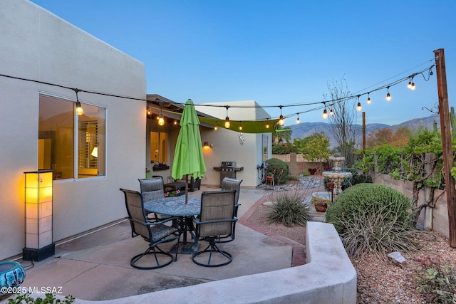 499 W Windowmaker Rd, Tucson, AZ 85737 - view of patio with fence, a mountain view, and outdoor dining space