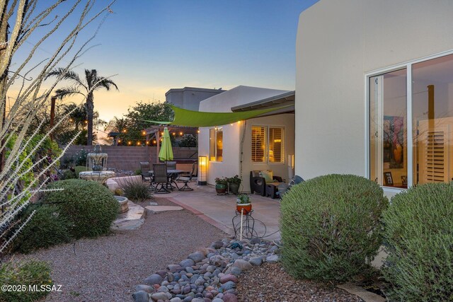 499 W Windowmaker Rd, Tucson, AZ 85737 - back of property featuring a patio area, outdoor dining area, stucco siding, and fence
