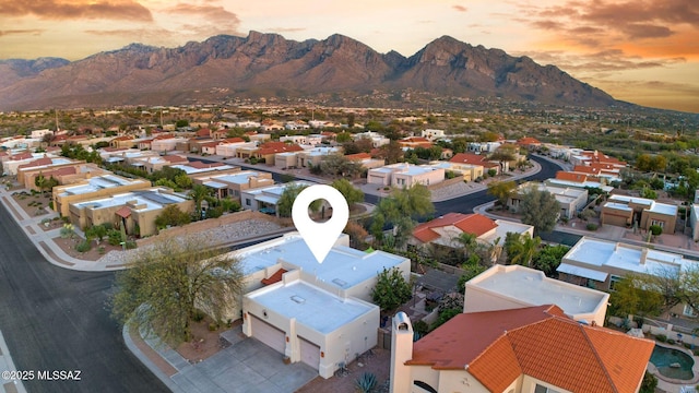 499 W Windowmaker Rd, Tucson, AZ 85737 - aerial view at dusk with a mountain view and a residential view