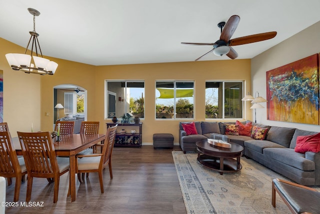 499 W Windowmaker Rd, Tucson, AZ 85737 - interior space featuring dark wood-type flooring, ceiling fan, arched walkways, and baseboards