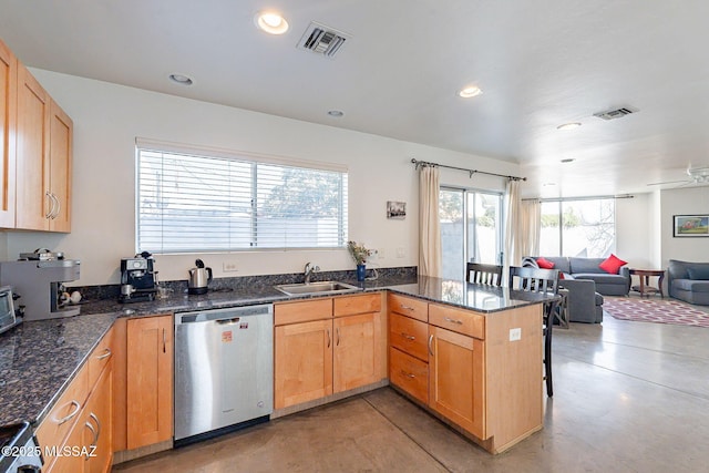 kitchen with visible vents, open floor plan, a peninsula, stainless steel dishwasher, and a sink