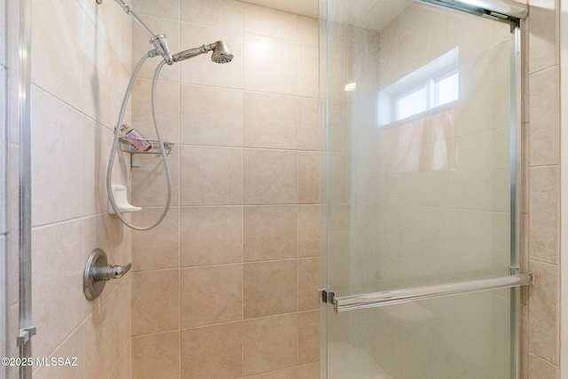 bathroom with a shower stall