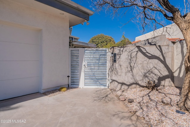 view of gate featuring fence