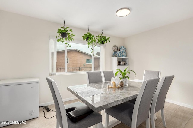 dining space with baseboards