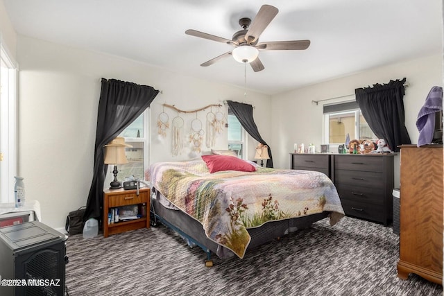 carpeted bedroom featuring ceiling fan